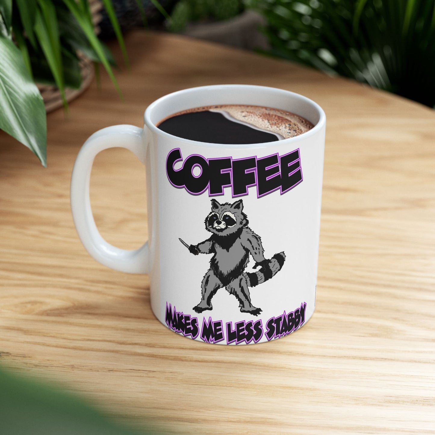 Funny Ceramic Mug - 'Coffee Makes Me Less Stabby' with Playful Racoon Design
